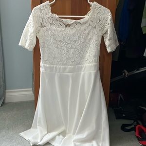 Good condition white lace top and plain bottom dress. Knee length